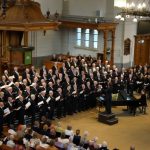 Apeldoorns Christelijk Mannenkoor ontvangt Koninklijke Erepenning bij 100-jarig jubileum